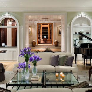 Inspiration for a timeless enclosed light wood floor living room remodel in Other with a music area, green walls and no tv