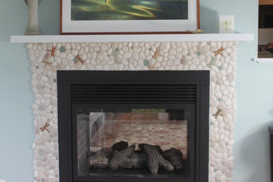 Inspiration for a living room remodel in Boston with a standard fireplace and a stone fireplace