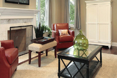 Living room - mid-sized dark wood floor living room idea in Raleigh with beige walls, a standard fireplace and a wall-mounted tv