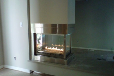 Medium sized classic formal open plan living room in Houston with a ribbon fireplace.