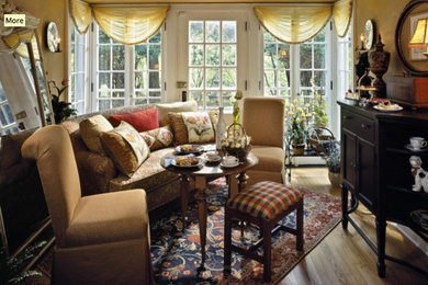 Transitional formal and enclosed medium tone wood floor living room photo in Boston with yellow walls
