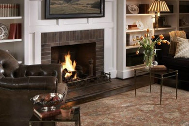 Mid-sized enclosed dark wood floor living room library photo in Other with white walls, a standard fireplace and a brick fireplace