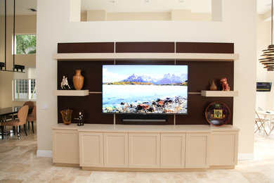 Example of a trendy open concept ceramic tile living room design in Miami with a media wall
