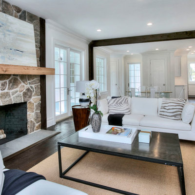 Inspiration for a large transitional formal and open concept dark wood floor and brown floor living room remodel in New York with white walls, a standard fireplace, a stone fireplace and no tv