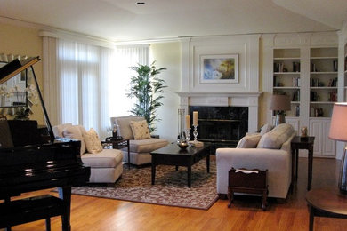 Example of a mid-sized classic enclosed medium tone wood floor living room design in San Francisco with a music area, yellow walls, a standard fireplace, no tv and a stone fireplace