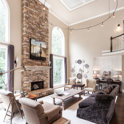 Large transitional formal and open concept dark wood floor and brown floor living room photo in Atlanta with beige walls, a standard fireplace, a stone fireplace and no tv