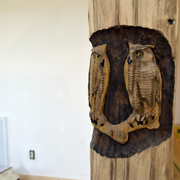 Owls carved into timber beam