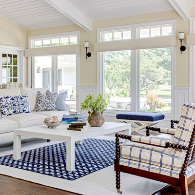 Inspiration for a large coastal open concept dark wood floor living room remodel in New York with beige walls