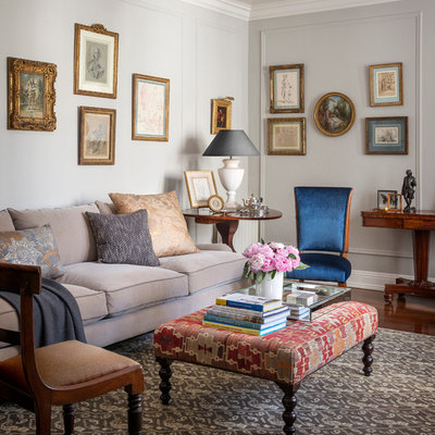 Example of a classic medium tone wood floor living room design in San Francisco with gray walls