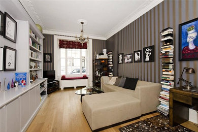 This is an example of a medium sized traditional living room in London.
