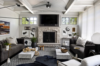 Trendy formal and enclosed living room photo in Chicago with gray walls, a standard fireplace, a stone fireplace and a wall-mounted tv