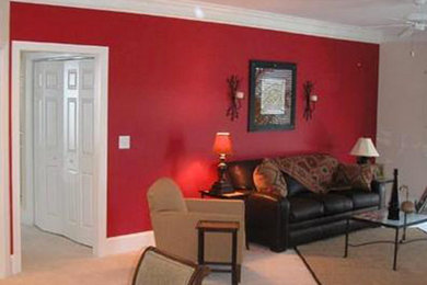 Example of a mid-sized enclosed carpeted living room design in Denver with red walls