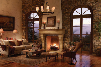 サクラメントにある高級な広いラスティックスタイルのおしゃれなリビング (ベージュの壁、濃色無垢フローリング、標準型暖炉、石材の暖炉まわり、テレビなし、茶色い床) の写真
