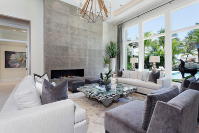 Example of an open concept living room design in Miami