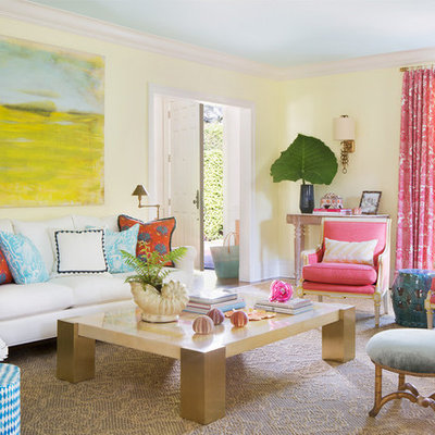 Inspiration for a mid-sized tropical enclosed and formal living room remodel in Miami with yellow walls