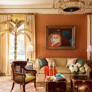 Elegant medium tone wood floor and brown floor living room photo in New York with red walls