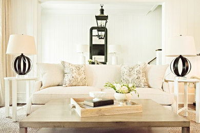 Example of a farmhouse carpeted living room design in Atlanta with white walls