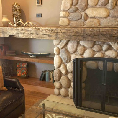 Mid-sized mountain style open concept bamboo floor and brown floor living room photo in San Francisco with brown walls, a standard fireplace and a stone fireplace