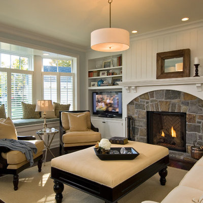 Elegant living room photo in New York with a stone fireplace