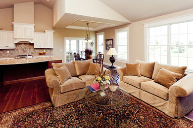 Living room - traditional open concept medium tone wood floor living room idea in Chicago with beige walls