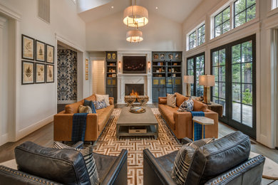 Example of a large classic open concept medium tone wood floor and brown floor living room design in Other with white walls, a standard fireplace, a stone fireplace and a wall-mounted tv
