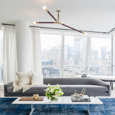 Example of a large trendy formal and open concept beige floor living room design in New York with white walls, no fireplace and no tv