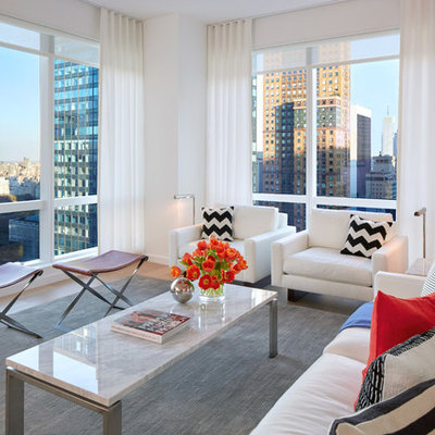 Living room - mid-sized contemporary open concept and formal light wood floor living room idea in New York with white walls and no tv