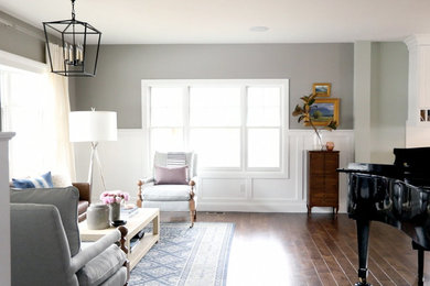 Mid-sized transitional enclosed dark wood floor living room photo in Salt Lake City with gray walls