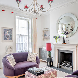 Photo of a traditional living room in Other with white walls, light hardwood flooring, a standard fireplace and beige floors.