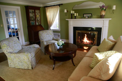Elegant formal and enclosed living room photo in New York with green walls, a standard fireplace and a tile fireplace