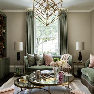 Design ideas for a medium sized classic formal enclosed living room in London with beige walls, dark hardwood flooring, a standard fireplace, no tv and brown floors.