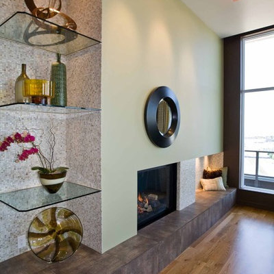 Example of a mid-sized trendy open concept medium tone wood floor living room design in Portland with green walls, a standard fireplace and no tv