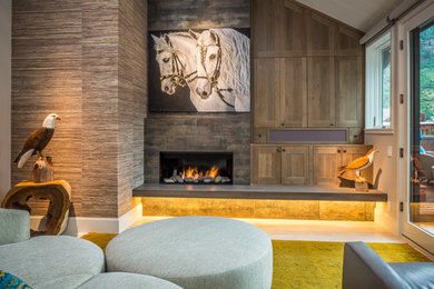 Medium sized modern formal and grey and teal open plan living room in Denver with beige walls, light hardwood flooring, a standard fireplace, a tiled fireplace surround and no tv.