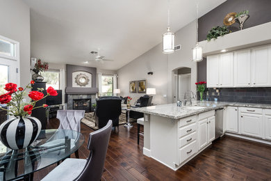 Example of a large transitional open concept dark wood floor living room design in Phoenix with gray walls, a standard fireplace, a tile fireplace and a tv stand