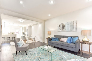 Photo of a contemporary open plan living room in DC Metro with grey floors.