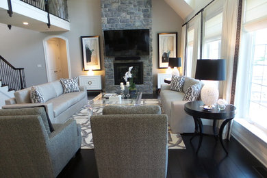 Living room - large contemporary open concept dark wood floor living room idea in Miami with white walls, a standard fireplace, a stone fireplace and a wall-mounted tv