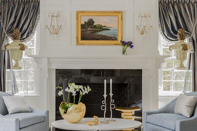 Mid-sized elegant formal and open concept living room photo in Boston with white walls, a standard fireplace, a plaster fireplace and no tv