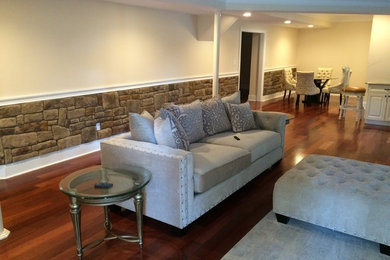 Photo of a medium sized traditional formal open plan living room in Philadelphia with beige walls, dark hardwood flooring, a standard fireplace and a wall mounted tv.