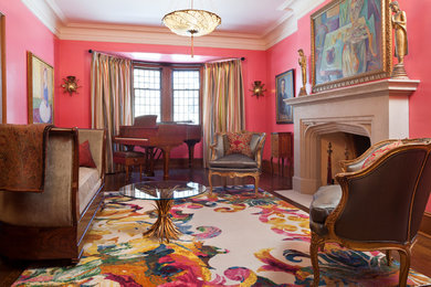 Example of a large eclectic formal and enclosed dark wood floor living room design in Toronto with pink walls and a standard fireplace