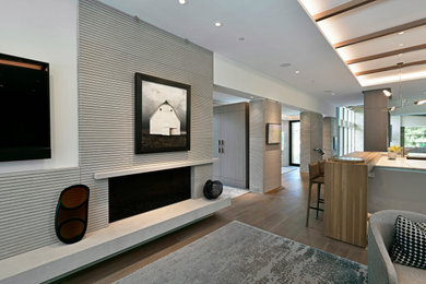 Living room - modern open concept living room idea in Cleveland with a standard fireplace and a stone fireplace