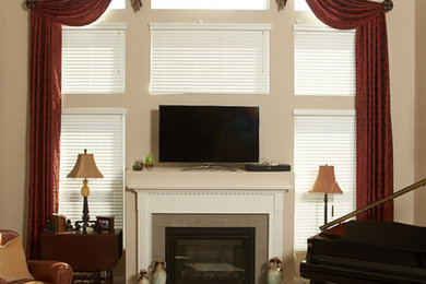 Example of a mid-sized classic formal and open concept carpeted living room design in Columbus with beige walls, a standard fireplace, a tile fireplace and a tv stand