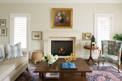 Elegant formal dark wood floor living room photo in Denver with beige walls, a standard fireplace and a stone fireplace