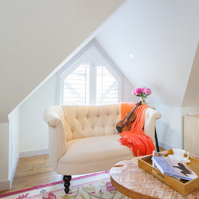 Example of a small farmhouse loft-style light wood floor living room design in Vancouver with white walls, no fireplace and no tv