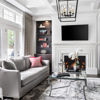 Mid-sized trendy formal and enclosed dark wood floor living room photo in Toronto with a standard fireplace, a plaster fireplace, a wall-mounted tv and white walls