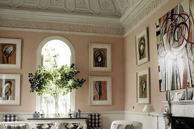 Inspiration for a classic enclosed living room in Other with pink walls.