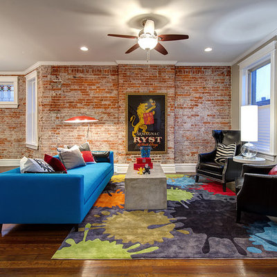 Inspiration for a mid-sized modern open concept dark wood floor and brown floor living room remodel in St Louis with gray walls, no tv and no fireplace