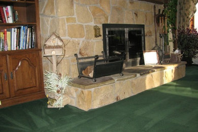 Arts and crafts living room photo in Other with white walls, a standard fireplace and a concrete fireplace