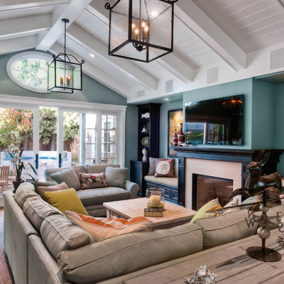 Living room - traditional living room idea in San Francisco with blue walls, a standard fireplace and a wall-mounted tv