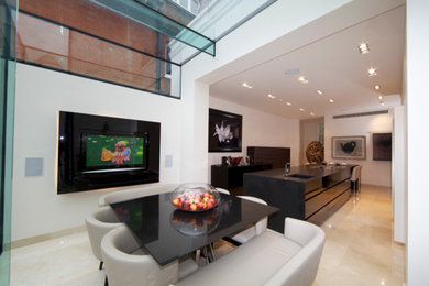 Inspiration for a large contemporary open plan living room in London with white walls and a built-in media unit.