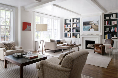 Traditional living room in New York with white walls, medium hardwood flooring, a standard fireplace and no tv.